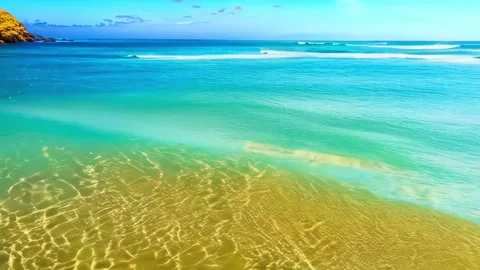 Small waves on a beautiful beach with clear water. Stock Footage 288206891
