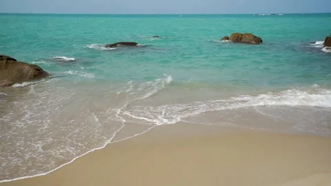 Small Waves On a Beautiful Beach Stock Footage 244761774