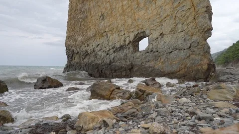 Small waves of the black sea hit the stone coast in Praskoveevka, Gelendzhik Stock Footage 122812254