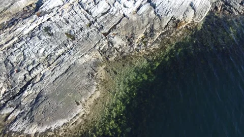 Small waves in blue sea hitting small island, aerial overview background Stock Footage 275615477