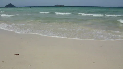 Small Waves Break on Golden Beach Stock-Footage 664332