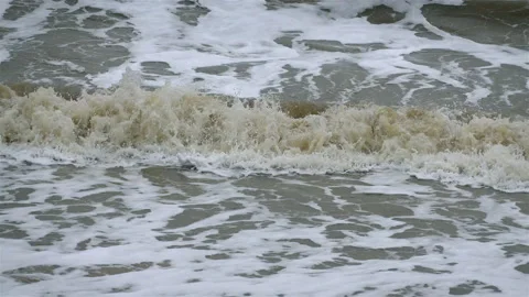 Small waves breaking on beach Stock Footage 166175800