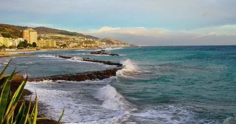 Small waves breaking on the beach in the Italian sea Stock Footage 242236062