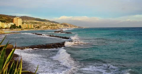 Small waves breaking on the beach in the Italian sea Stock Footage 242237191
