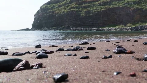 Small waves breaking on a beach. Low angle view Stock Footage 235452291