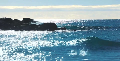 Small waves breaking on the reefs in the Italian sea Stock Footage 239146507
