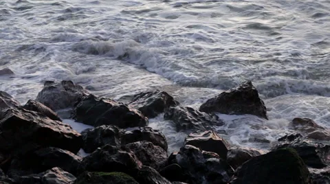 Small Waves Breaking on Rocks Stock Footage 35408873