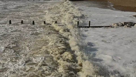 Small waves breaking on shingle beach Video stock 86512427