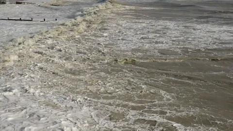 Small waves breaking on shingle beach Video stock 86512531