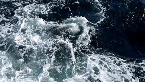 Small waves breaking in tetrapod Stock Footage 69873838