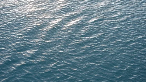 Small waves on the calm sea in the early morning with subtle motion 02 Stock Footage 90337780