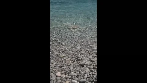 Small waves in clear blue sea. Sea beach landscape. Stock Footage 316920479