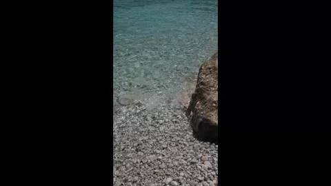Small waves in clear blue sea. Sea beach landscape. Stock Footage 316920481