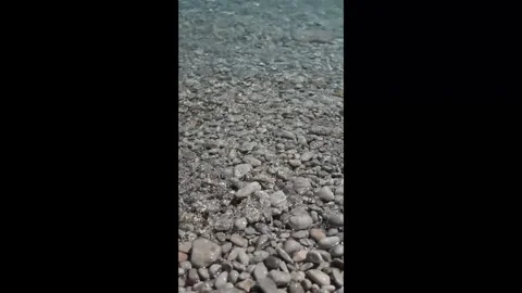 Small waves in clear blue sea. Sea beach landscape. Stock Footage 316920482