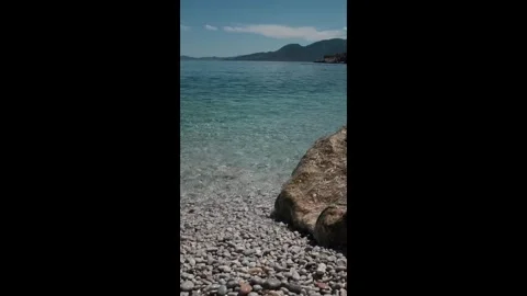 Small waves in clear blue sea. Sea beach landscape. Stock Footage 316920483