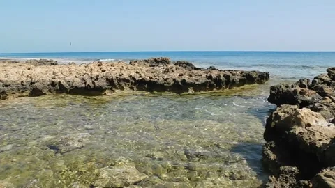 Small waves, clear water in the stone sea bay. Protaras. Cyprus. April 2021 Stock Footage 153199055