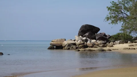 Small Waves coming to rock and beach on the coast of sea bay of Andaman sea Stock Footage 107753036