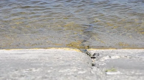 Small waves on concrete shore Stock Footage 50451601