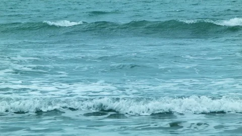 Small waves crash at the beach Stock Footage 89702493