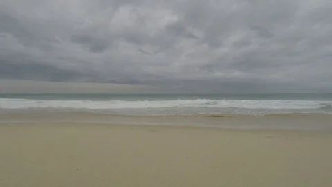 Small Waves Crashing on a Beach Stock Footage 73641311