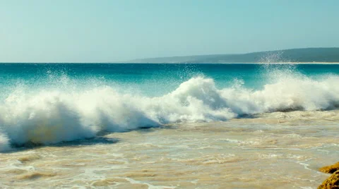 Small Waves Crashing Onto A Reef At A Beautiful Beach Stock Footage 51560355