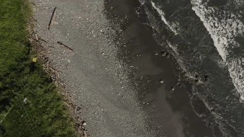 Small waves crashing on rocky beach shore of Taitung, Taiwan Stock Footage 131407192