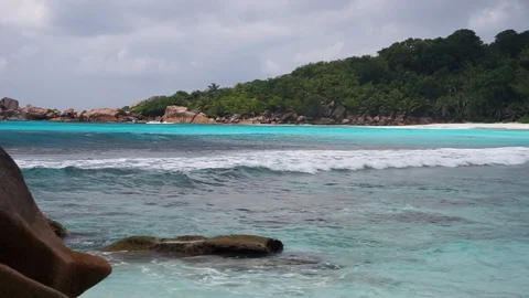 Small waves crashing on a tropical beach Stock Footage 101661048