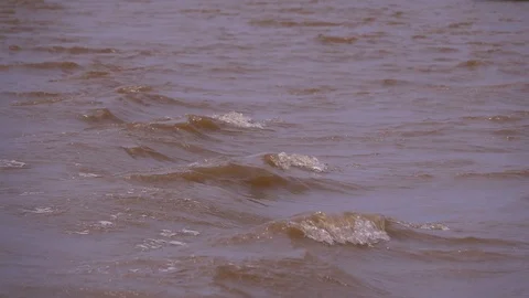 Small waves created in fresh water river behind motor boat wake slow motion 2 Vídeo Stock 87703413