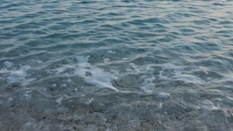 Small waves crushing at sunset on a pebble beach in Croatia 스톡 동영상 127514121