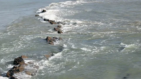 Small waves flowing over rocks 1 Stock Footage 35247531