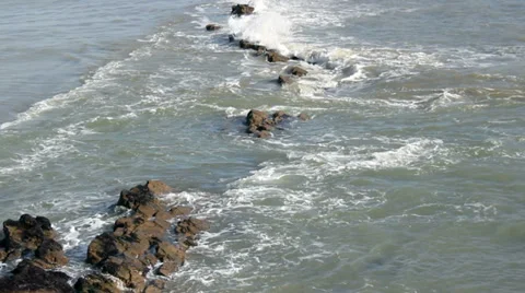 Small waves flowing over rocks 2 Stock Footage 35249819