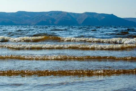 Small waves follow one another. Stock Photos