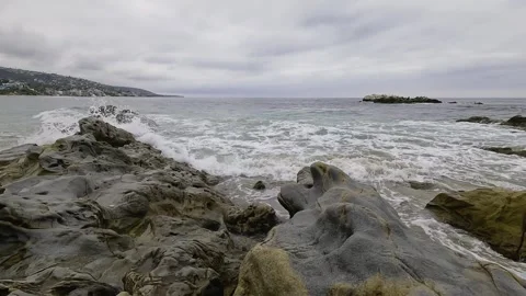 Small Waves Gently Crash on the Rocks in Laguna Beach Stock Footage 288408128