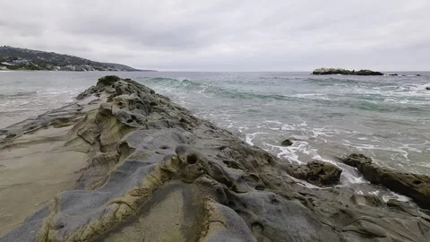 Small Waves Gently Crash on the Rocks in Laguna Beach Stock Footage 288408257