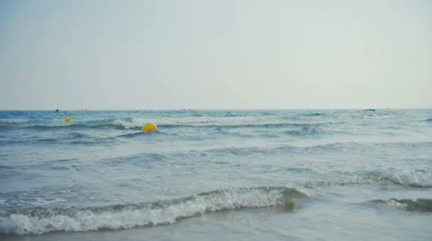 Small waves goes on camera in slow-motion Stock Footage 64962054