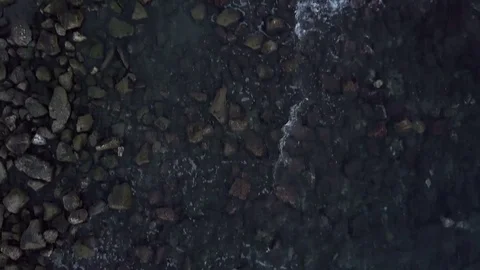 Small waves hit the cliff. Aerial vertical videos. About reflection, sea, ocean, Stock Footage 70590591
