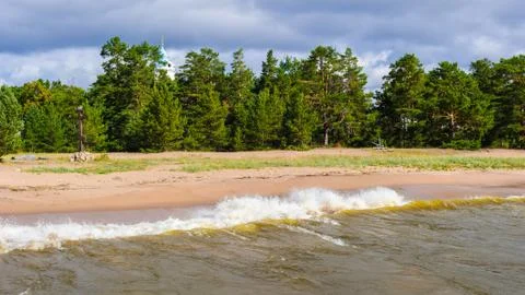 Small waves hit lightly the shore Stock Photos