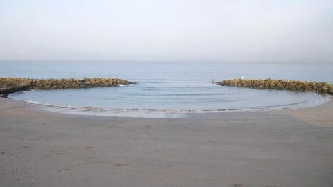 Small waves hit shoreline of the North Sea beach Stock Footage 71161836