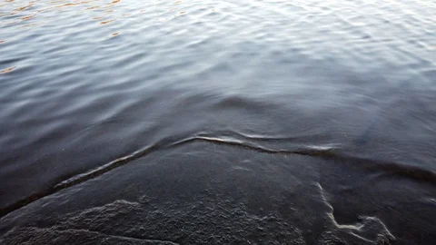 Small waves hitting rocky shore, Finland Stock Footage 118574173