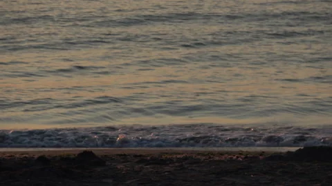 Small waves hitting the shore Video stock 232621779