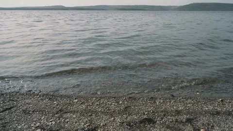 Small waves on the lake. View of the hills Stock Footage 256215958