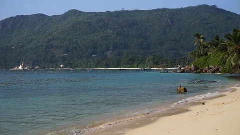 Small waves lapping on on the shore of a calm beach Stock Footage 101659019