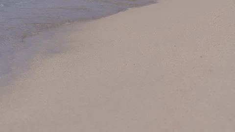 Small waves lapping on white sandy Caribbean beach Stock Footage 105731743