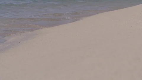 Small waves lapping on white sandy Caribbean beach Stock Footage 105731880