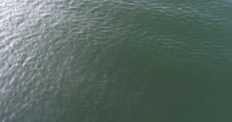 Small waves on ocean with bright reflections from the sun. Stock Footage 107061387