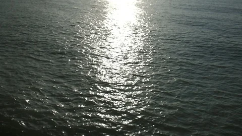 Small waves oscillate in the water Video stock 128797675