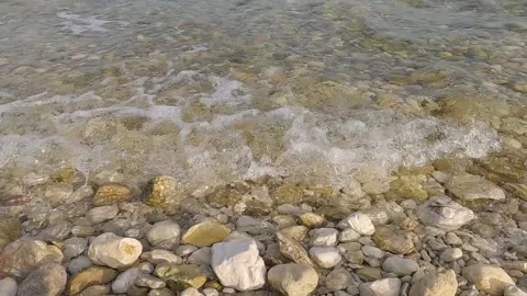 Small waves on the pebble beach Stock Footage 317309028