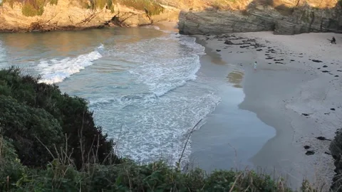 Small waves reaching Os Castros beach Stock Footage 290982258