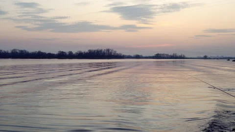 Small waves in the river, lake. Boats float on the water in the distance Stock Footage 142593989