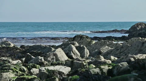 Small waves rock coast line and the sea Stock Footage 57600002